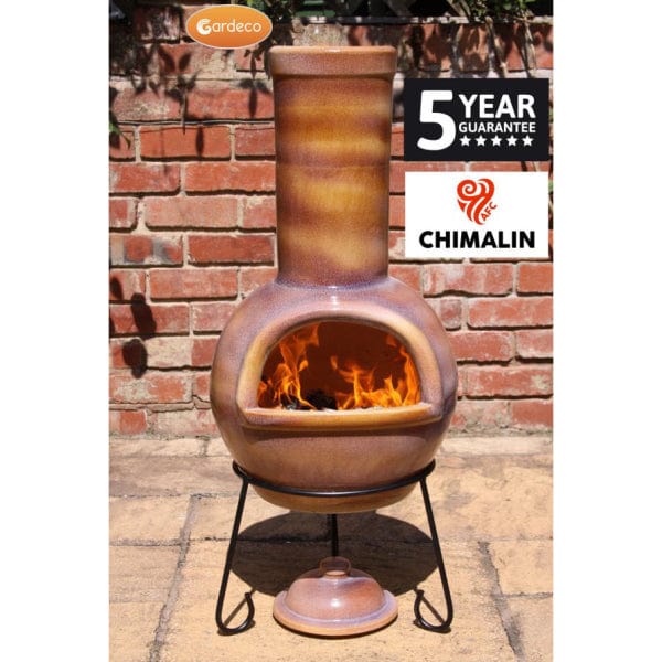 Gardeco Sempra Large Glazed Caramel Chimalin AFC Chiminea With Burning Logs Inside In A Sunny Garden Setting | SKU: AFC-C21.76 | Barcode: 5031599045054