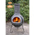 Gardeco Linea XL Mexican Chimenea In Grey With Fuel Inside In A Sunny Garden Setting | SKU: C6L.46 | Barcode: 5031599047362